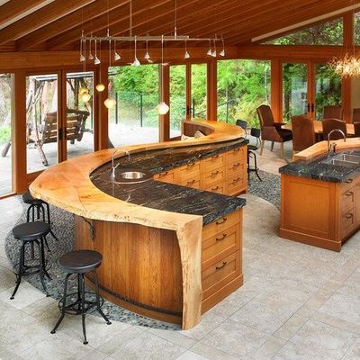 Massive S-shaped kitchen island with built-in banquet